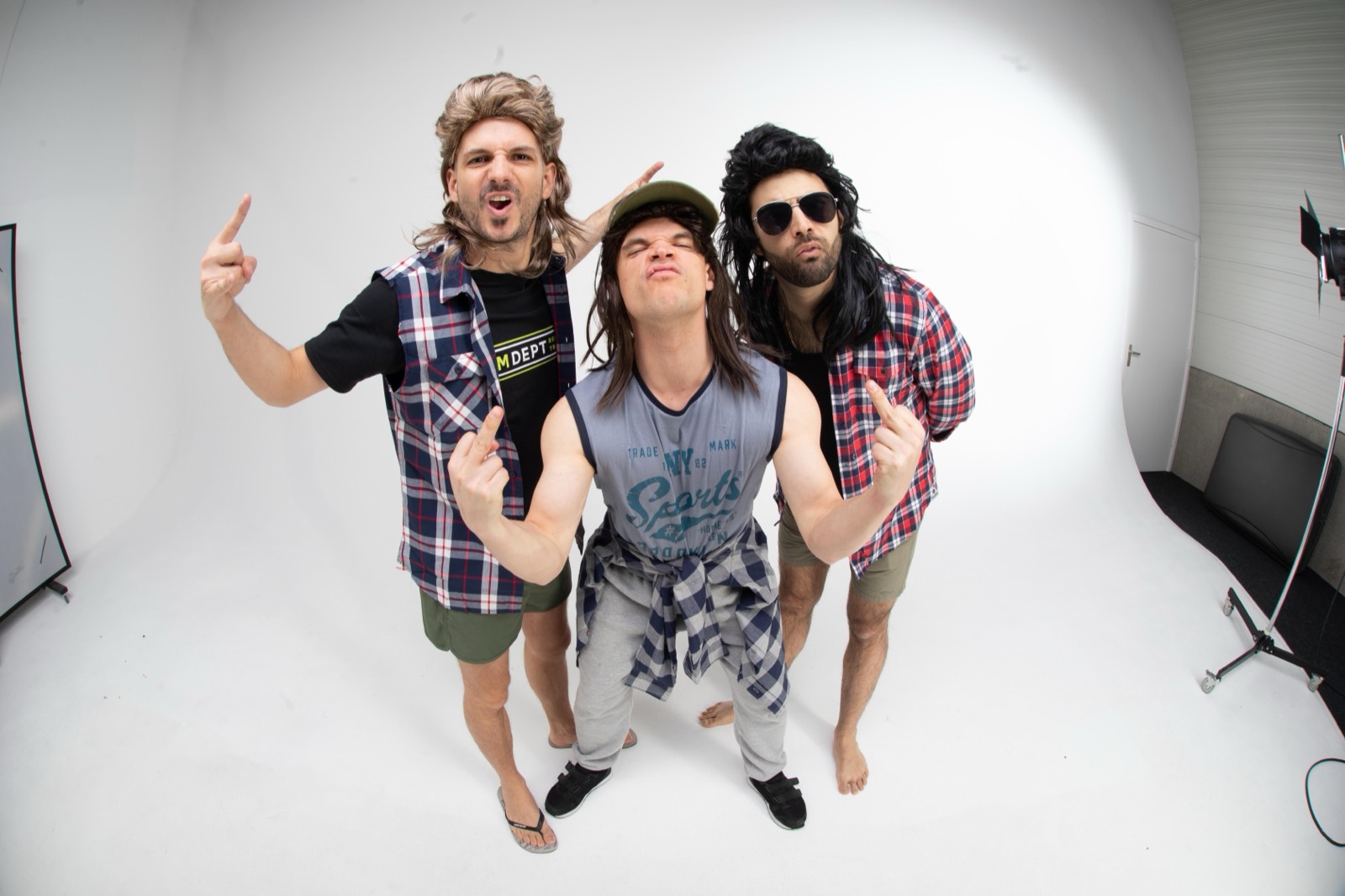 The blokes throwing up rude gestures at the camera